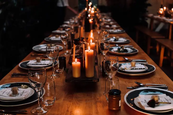 Candlelit gala tables set for a seated dinner